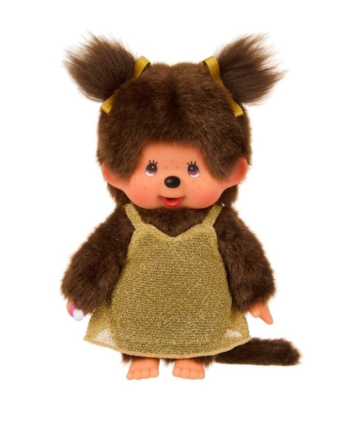 Meisje in gouden glitterjurk 20 cm